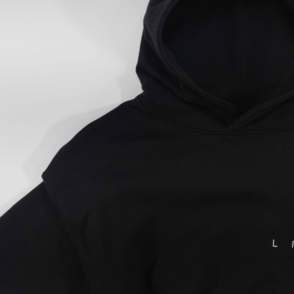 Black details hoodie with minimalist design.