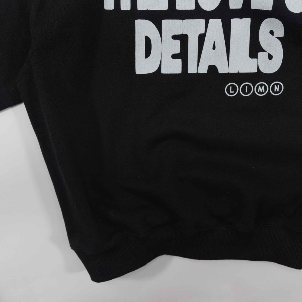 Black hoodie with "For the Love of Details" text print.