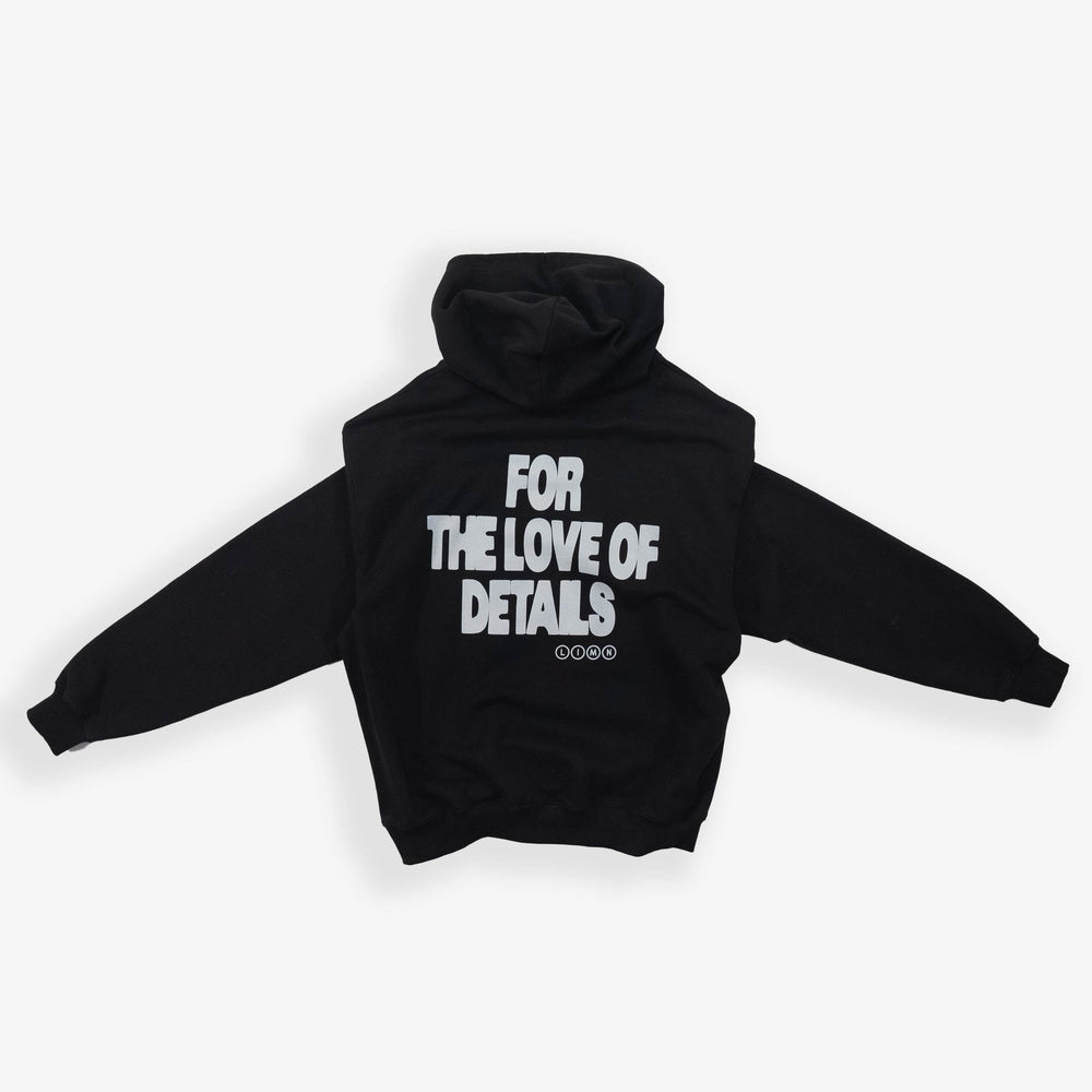 Black hoodie with "For the Love of Details" printed on the back.