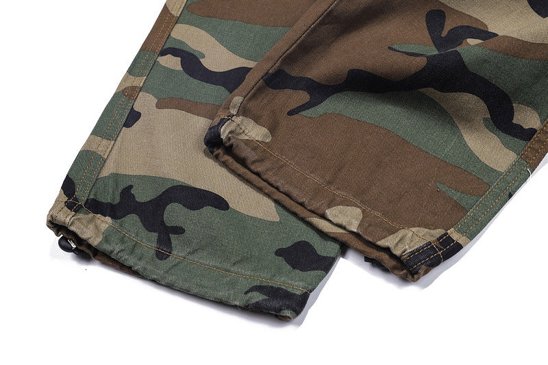 Camo trousers with green and brown camouflage pattern.