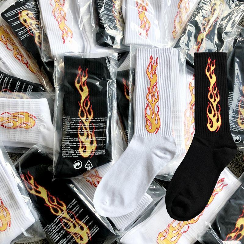 Flames socks featuring vibrant flame designs in white and black, one size fits all.