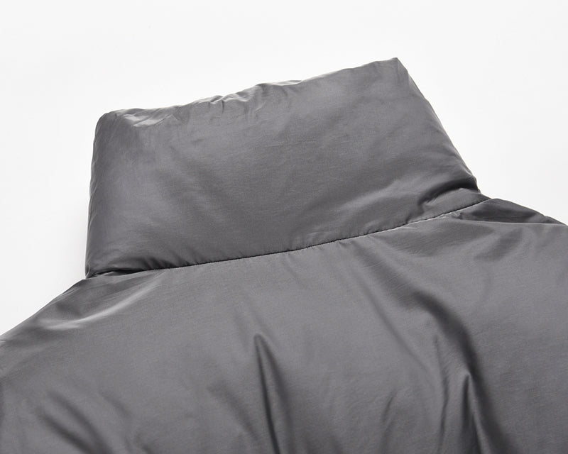 Gray padded round jacket with high collar.