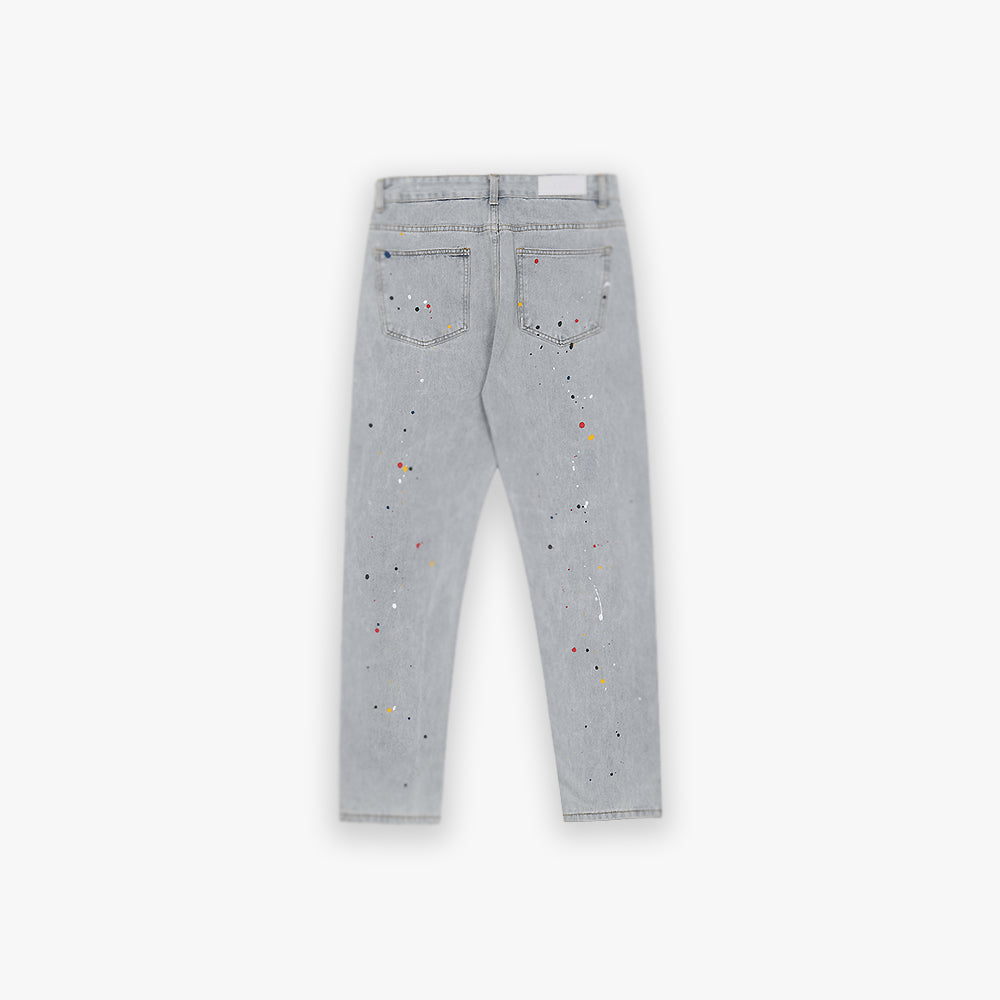 Light-blue paint splatter denim with a distressed look and slightly looser fit.
