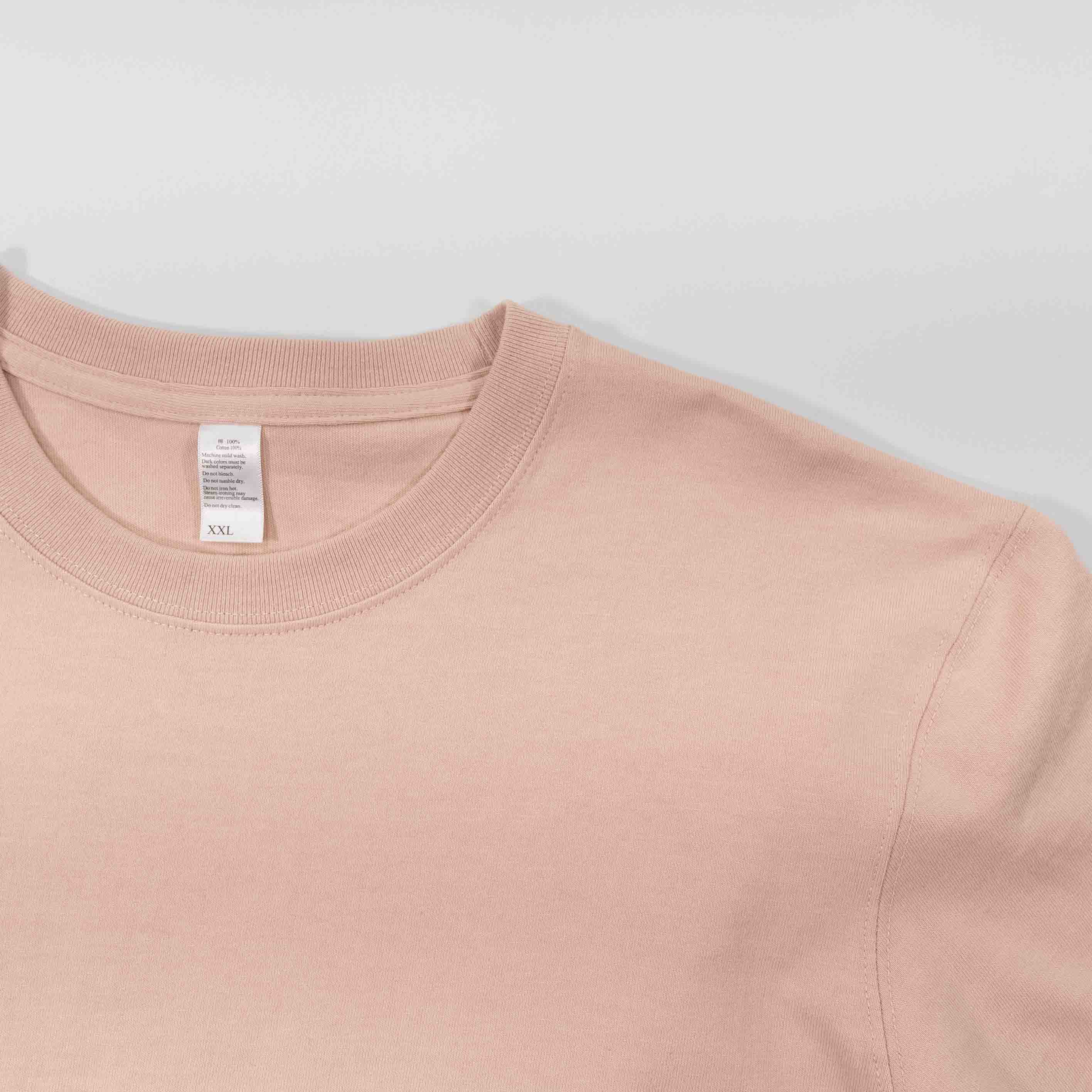 Peach Winter Tee in soft fabric, close-up view.