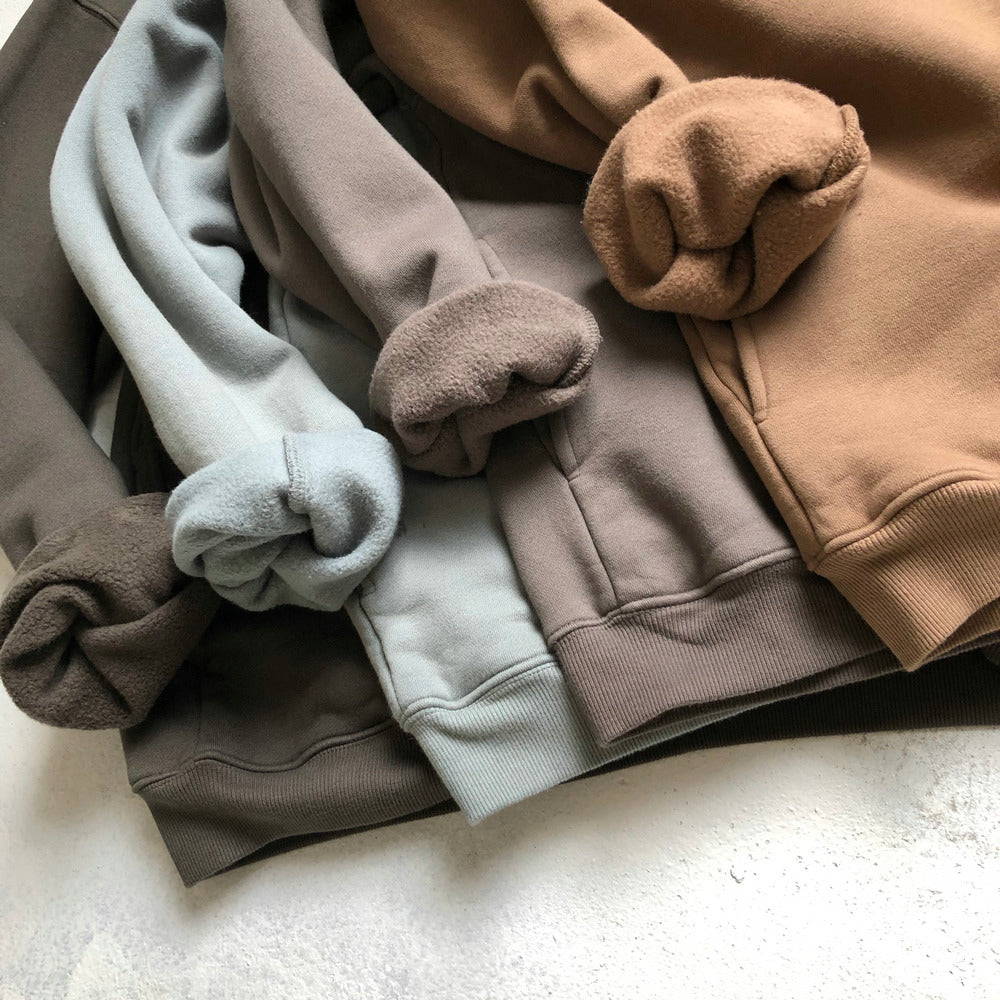 Assorted Ashe Zip-Up Hoodies in various colors laid out.