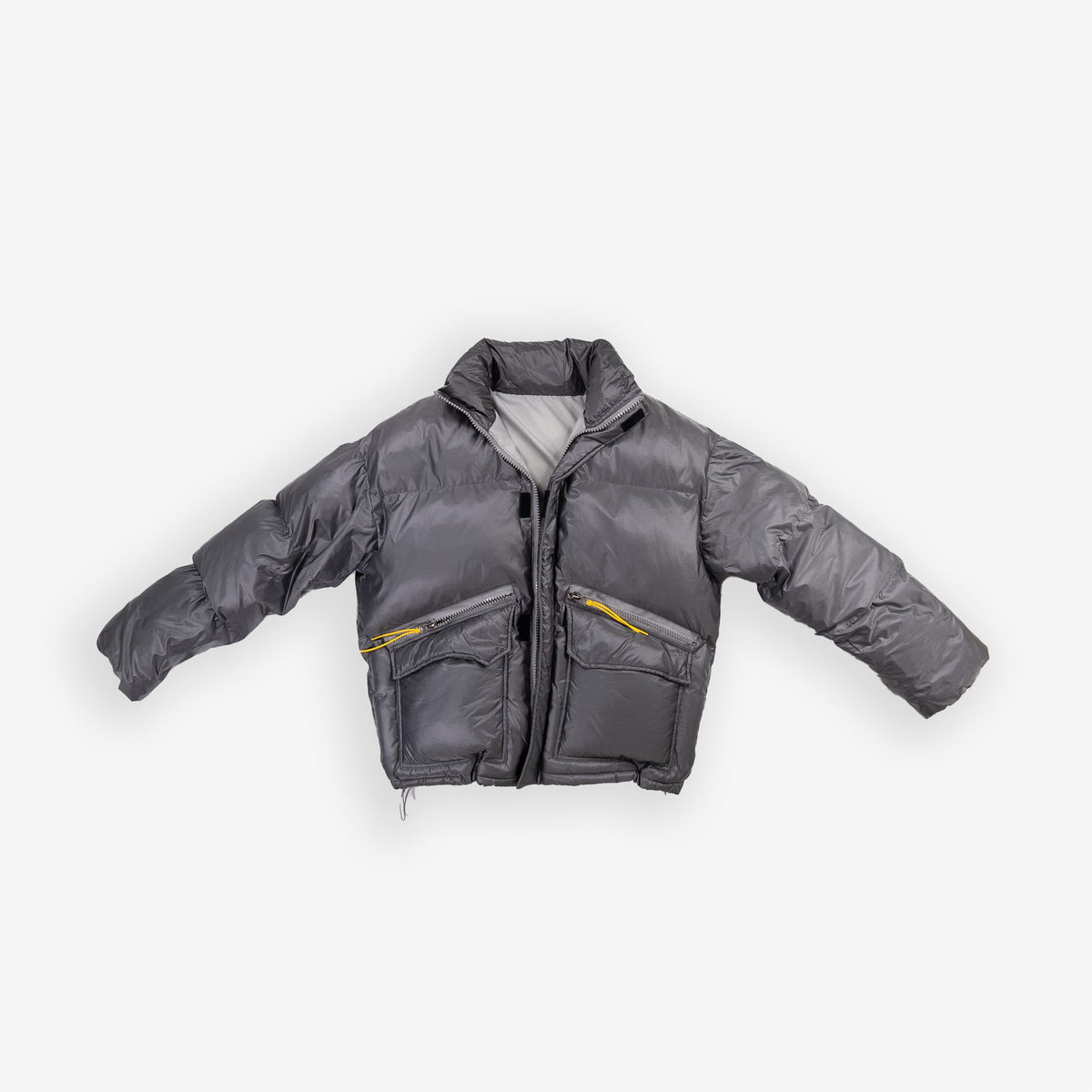 Gray padded round jacket with front pockets.