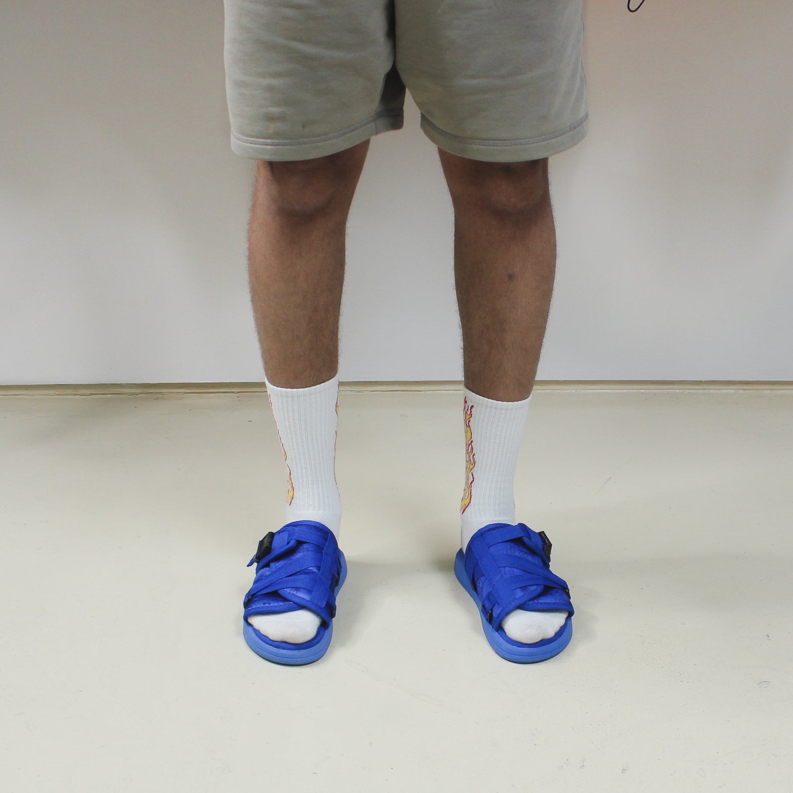 Cobalt Blue Slides worn with socks and shorts.