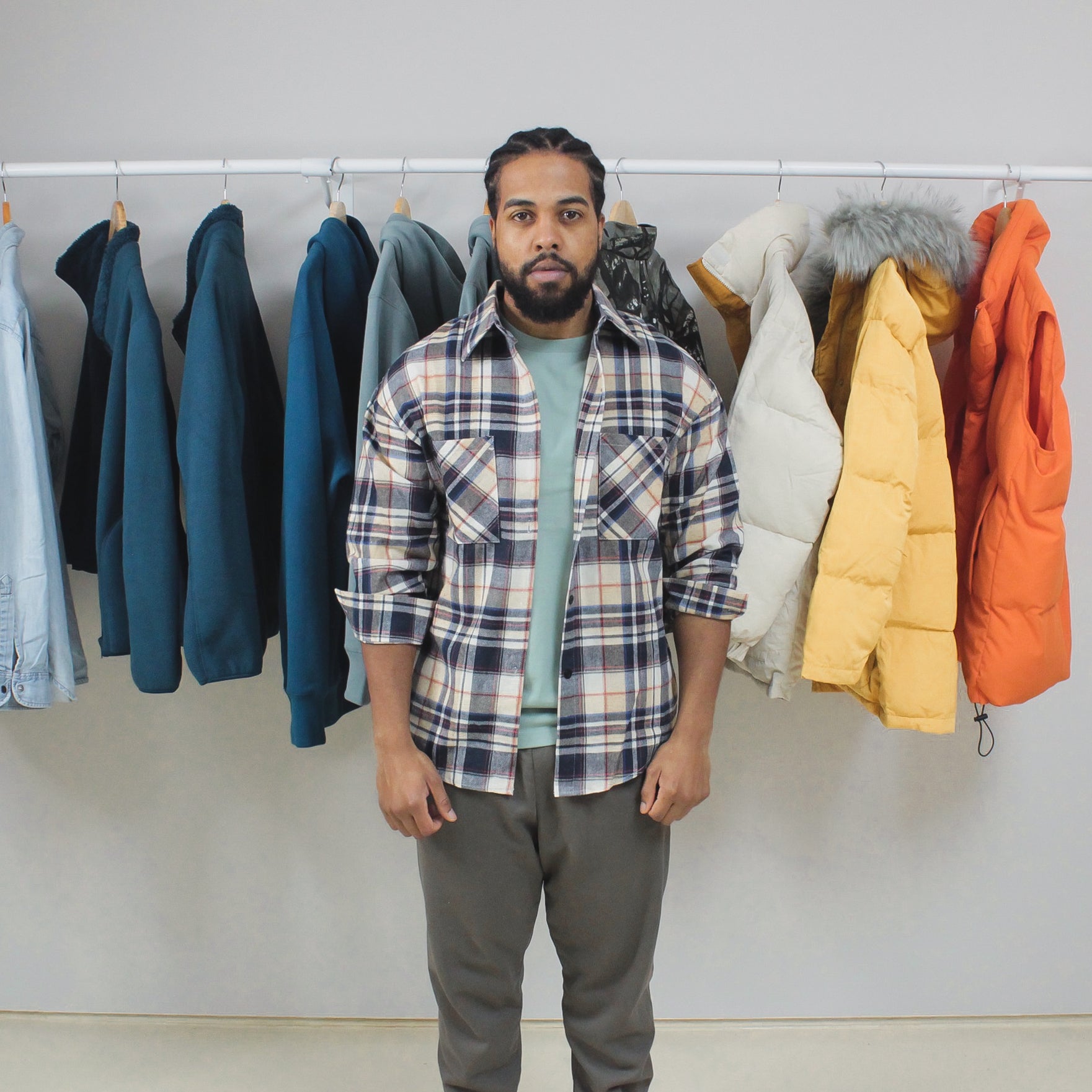 Man wearing Mint Winter Tee in a clothing store.