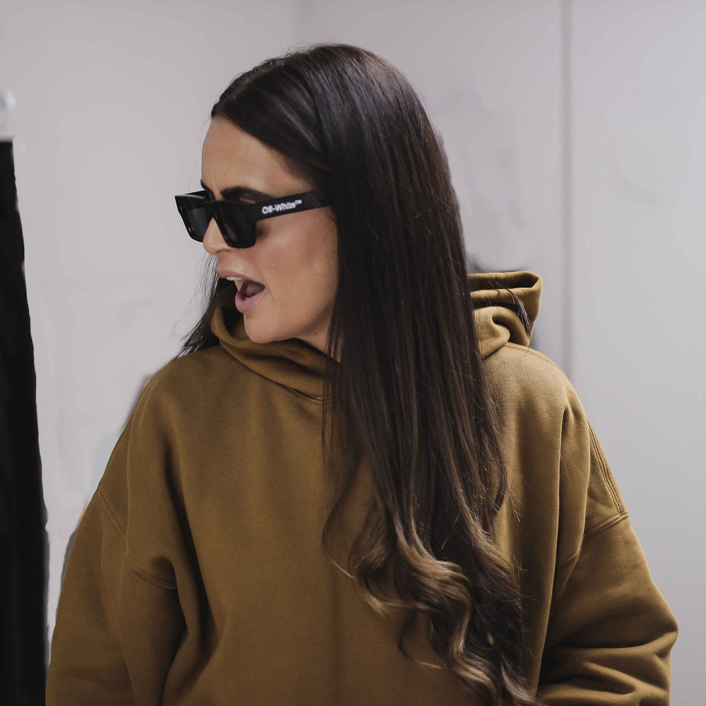 Woman wearing a double layer hoodie.