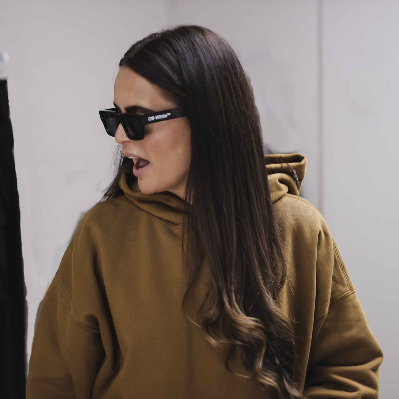 Woman wearing a double layer hoodie.