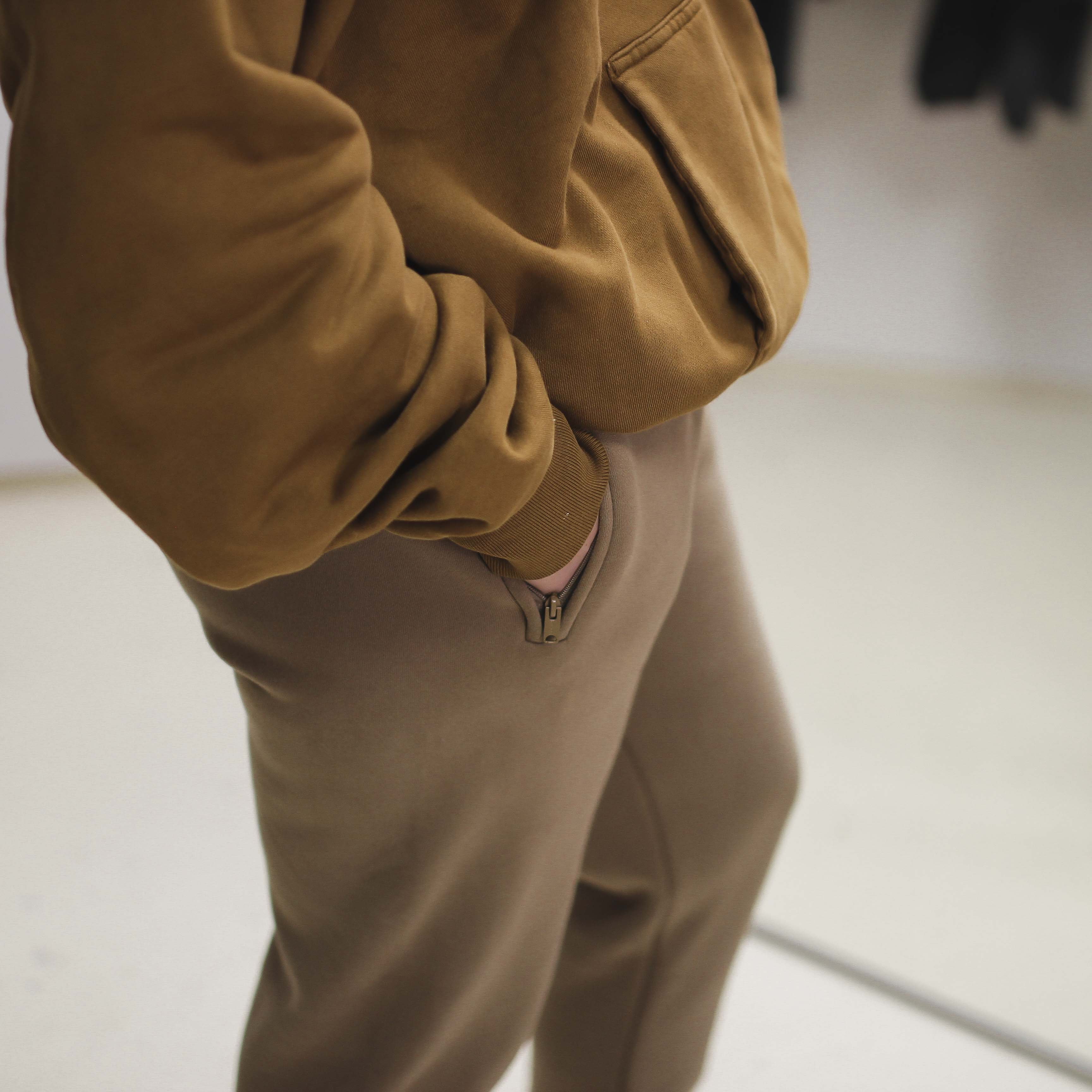 Double Layer Hoodie in brown fabric detail.