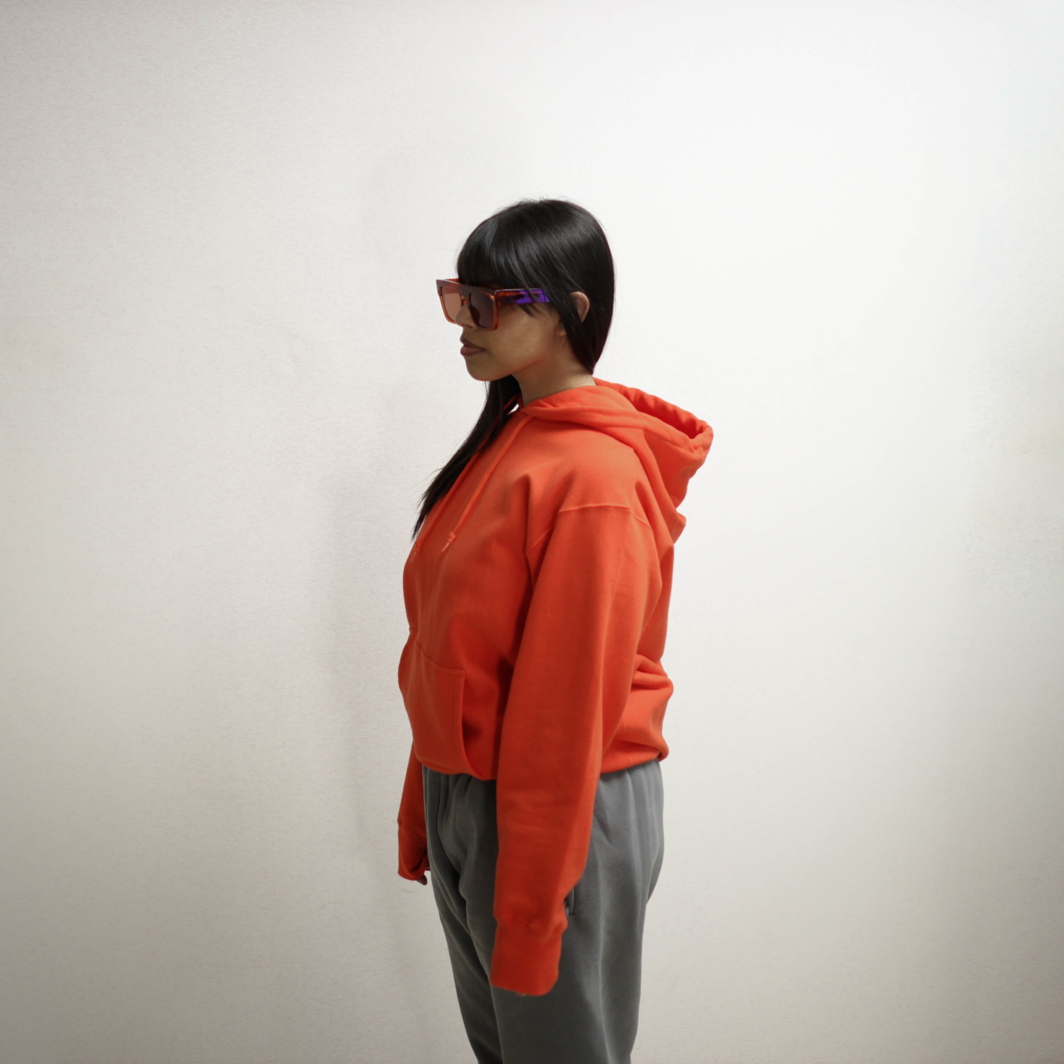 Person wearing an orange Infrared Hoodie.