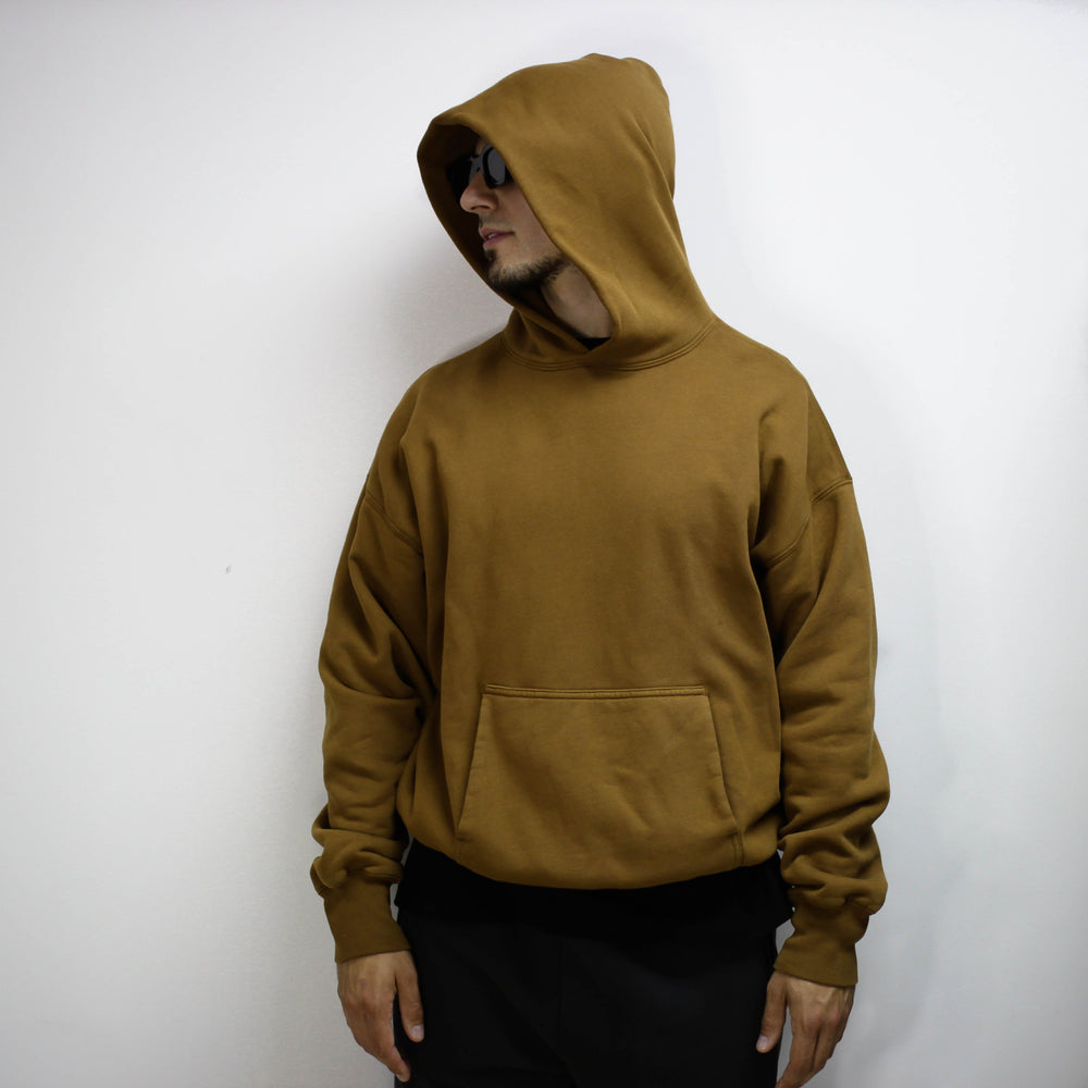 Brown double layer hoodie worn by a person.