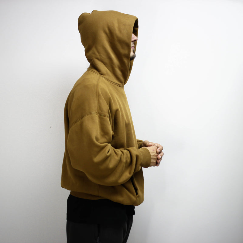 Brown double layer hoodie worn by a person.