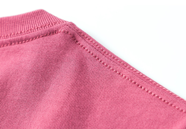 Close-up of a plum winter t-shirt fabric detail.