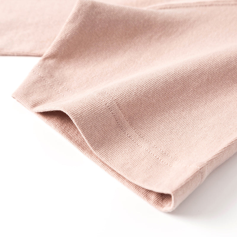 Close-up of a Peach Winter Tee fabric texture.