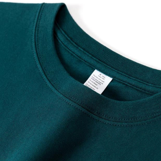 Jade Green Winter Tee folded close-up.