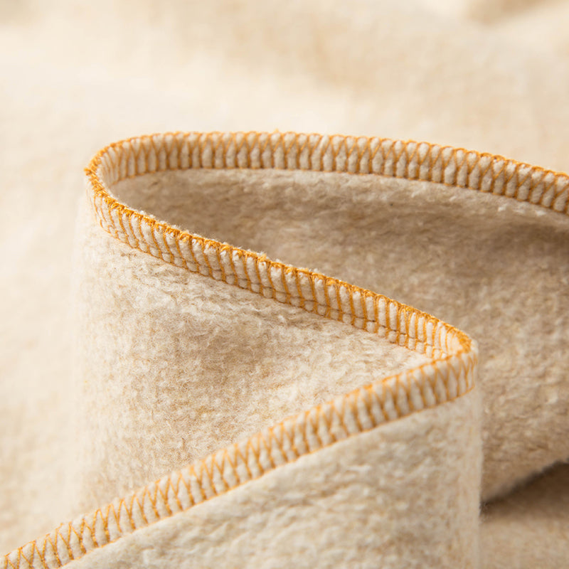 Close-up of fabric detail on an Amber Zip-Up Hoodie.