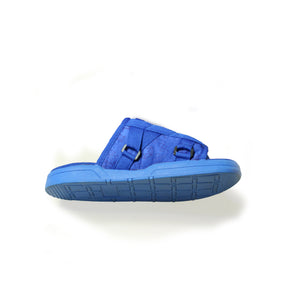 cobalt blue adjustable tightening strap slider laid on floor showing sole
